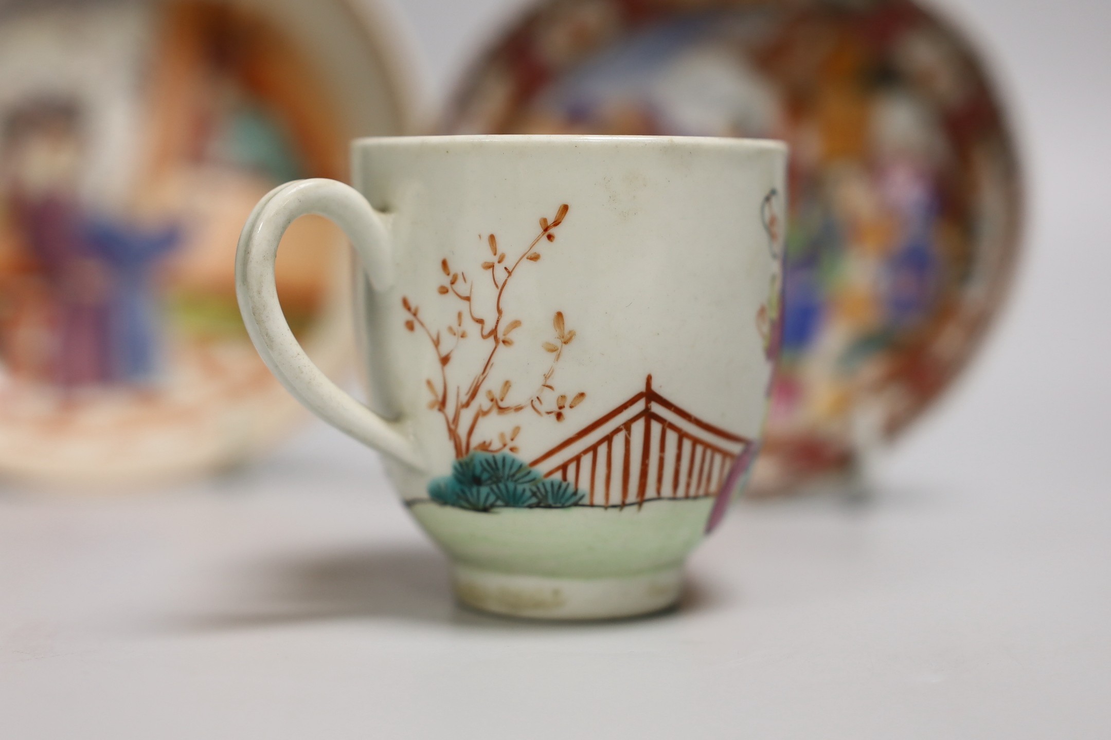 An 18th century Worcester porcelain coffee cup, a later saucer and a Chinese saucer, cup 6.5cms high